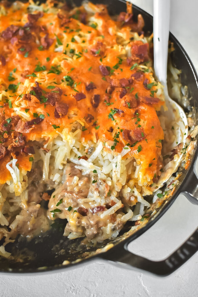 homemade cowboy casserole in a cast iron pan | thefarmstyle