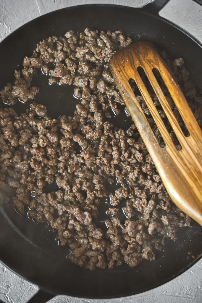 cooked ground beef in cast iron pan