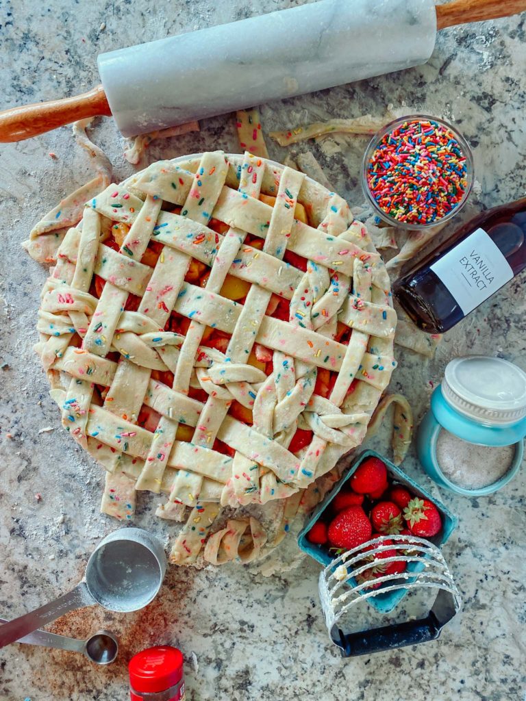 sprinkle pie crust with strawberries, vanilla extract, rolling pin, salt, sprinkles