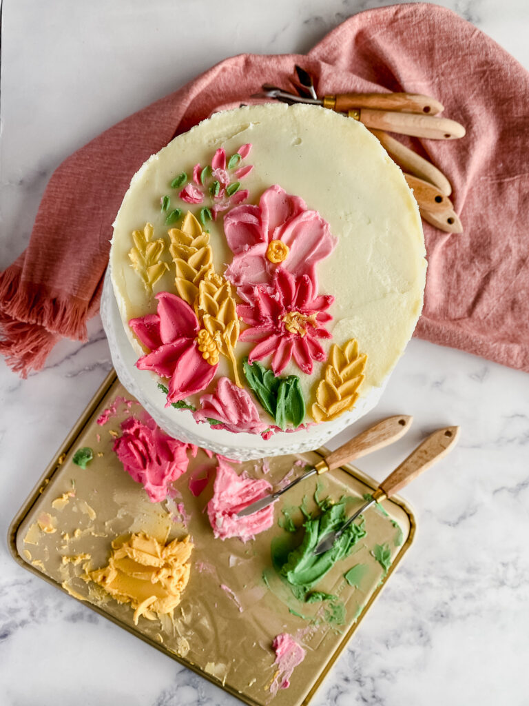 dahlia, cosmo, wheat buttercream decorated cake